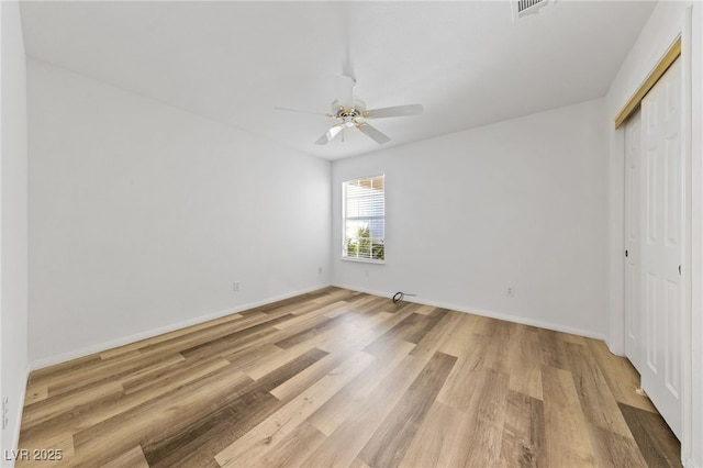 5232 Saranac Rd, Las Vegas, NV 89130 - unfurnished bedroom with light wood-type flooring, a closet, and baseboards