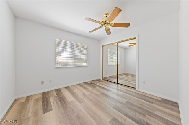 5232 Saranac Rd, Las Vegas, NV 89130 - unfurnished bedroom with wood finished floors, a closet, baseboards, and a ceiling fan