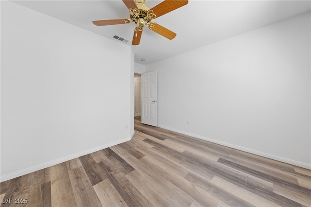 5232 Saranac Rd, Las Vegas, NV 89130 - empty room with wood finished floors, baseboards, and a ceiling fan