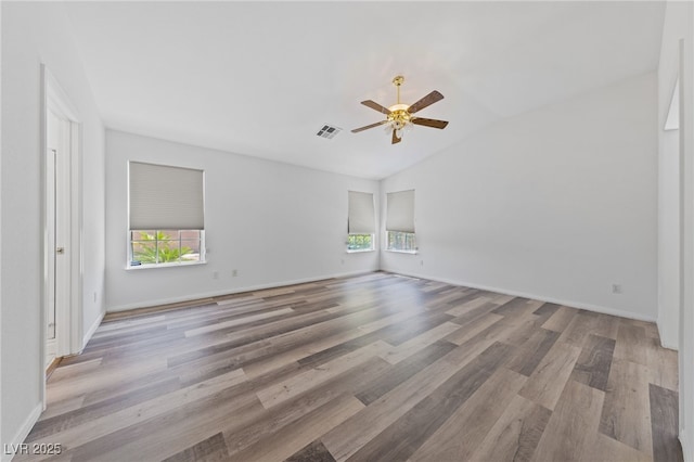 5232 Saranac Rd, Las Vegas, NV 89130 - unfurnished room featuring plenty of natural light, wood finished floors, lofted ceiling, a ceiling fan, and baseboards