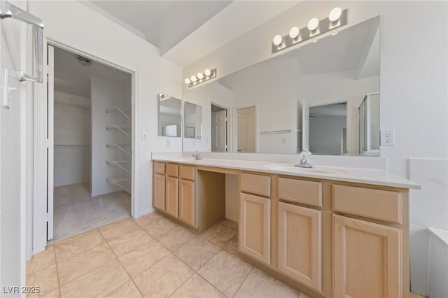 5232 Saranac Rd, Las Vegas, NV 89130 - full bath with double vanity, a spacious closet, and tile patterned flooring