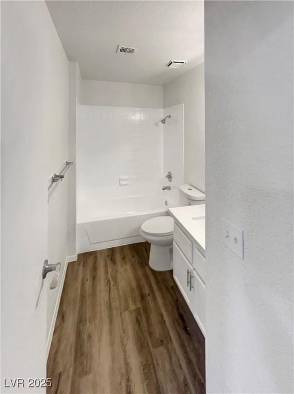 1832 Yellow Rose St, Las Vegas, NV 89108 - full bathroom featuring wood finished floors, vanity, toilet, and shower / washtub combination
