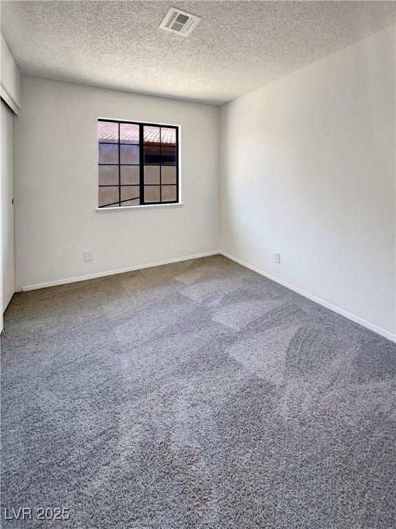 1832 Yellow Rose St, Las Vegas, NV 89108 - spare room featuring a textured ceiling, carpet, and baseboards