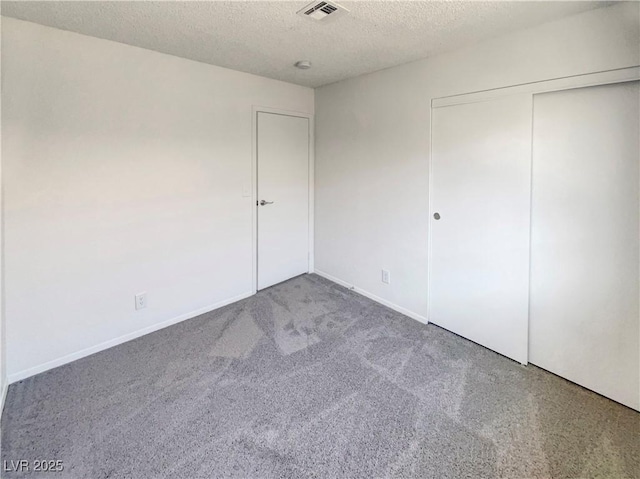 1832 Yellow Rose St, Las Vegas, NV 89108 - unfurnished bedroom with a textured ceiling, carpet floors, a closet, and baseboards