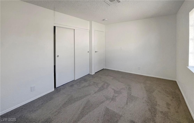 1832 Yellow Rose St, Las Vegas, NV 89108 - unfurnished bedroom featuring a textured ceiling, carpet floors, a closet, and baseboards