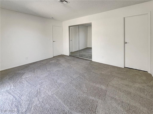 1832 Yellow Rose St, Las Vegas, NV 89108 - unfurnished bedroom with carpet flooring, a textured ceiling, and a closet