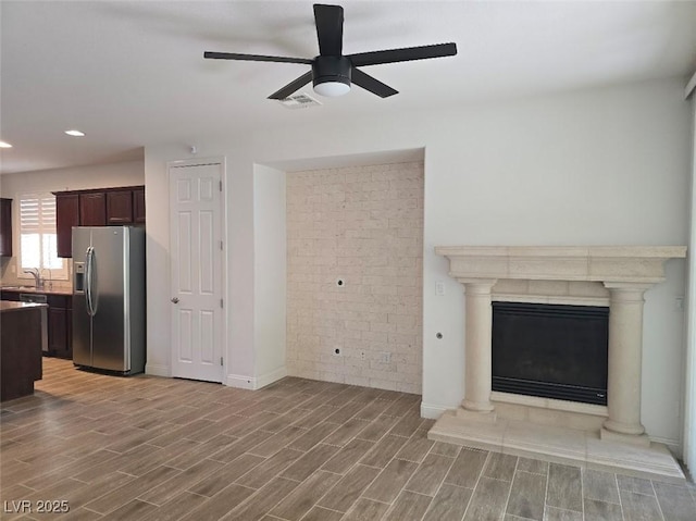 11298 Corsica Mist Ave, Las Vegas, NV 89135 - unfurnished living room with ceiling fan, light wood finished floors, and recessed lighting