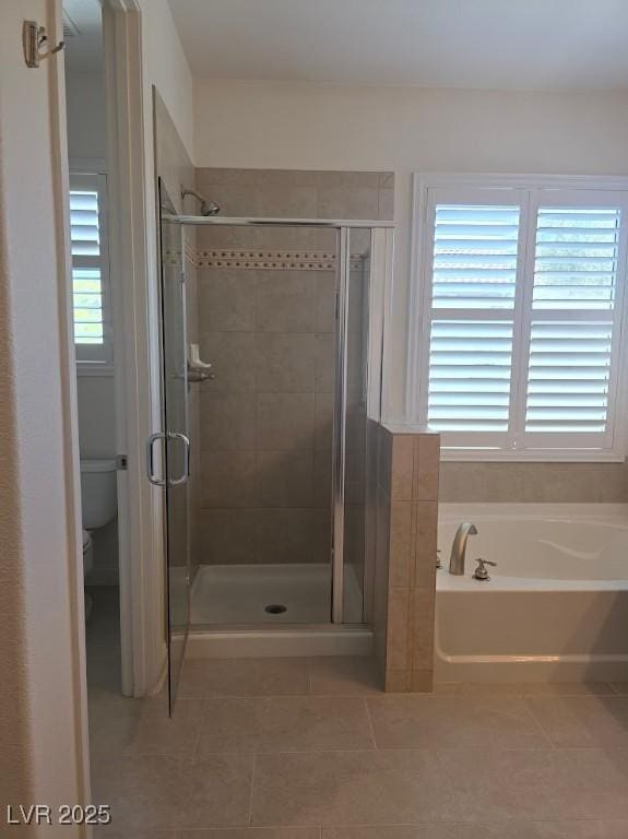 11298 Corsica Mist Ave, Las Vegas, NV 89135 - bathroom with a garden tub, a stall shower, and tile patterned flooring
