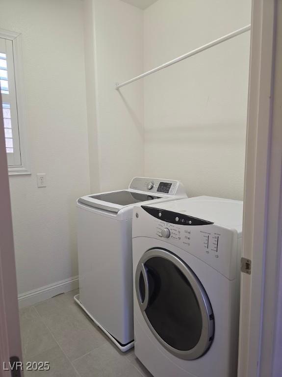 11298 Corsica Mist Ave, Las Vegas, NV 89135 - laundry room with washer and dryer and light tile patterned floors