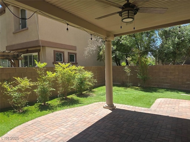 11298 Corsica Mist Ave, Las Vegas, NV 89135 - fenced backyard with a ceiling fan and a patio