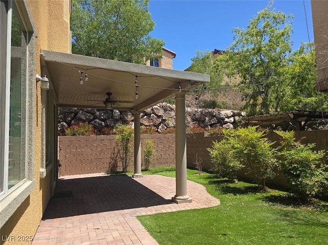 11298 Corsica Mist Ave, Las Vegas, NV 89135 - fenced backyard featuring a ceiling fan and a patio