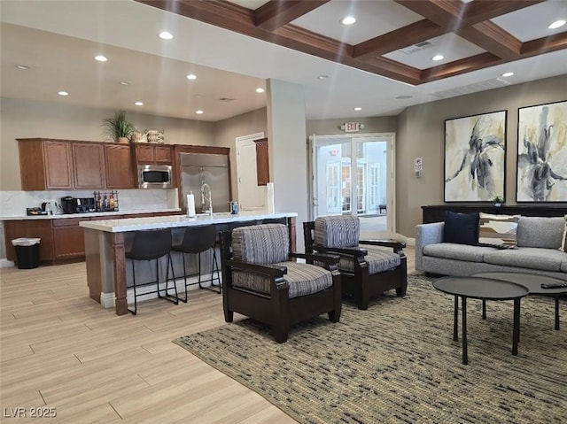 11298 Corsica Mist Ave, Las Vegas, NV 89135 - living room featuring light wood-style floors, coffered ceiling, beam ceiling, and recessed lighting