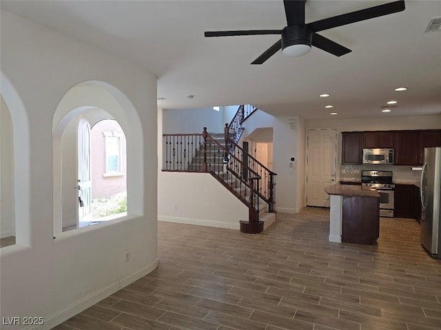11298 Corsica Mist Ave, Las Vegas, NV 89135 - kitchen featuring stainless steel appliances, open floor plan, a kitchen island, a ceiling fan, and recessed lighting