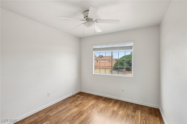 4552 Aviation St, Las Vegas, NV 89115 - spare room featuring baseboards, light wood-type flooring, and ceiling fan
