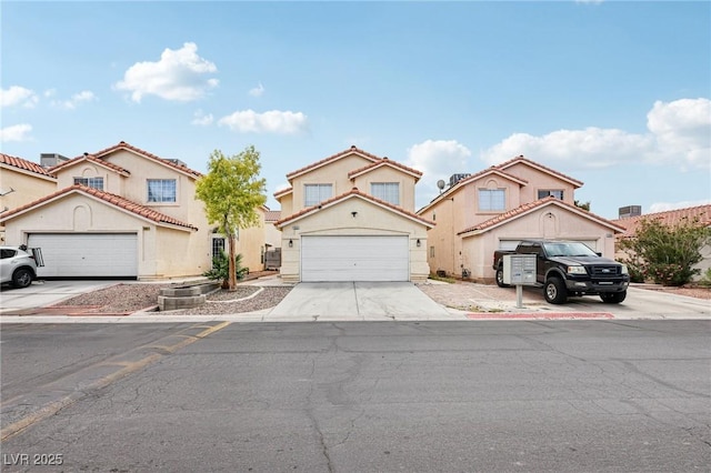 4552 Aviation St, Las Vegas, NV 89115 - view of front facade with concrete driveway, an attached garage, and stucco siding
