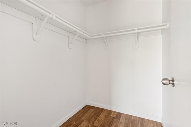 4552 Aviation St, Las Vegas, NV 89115 - walk in closet featuring wood finished floors