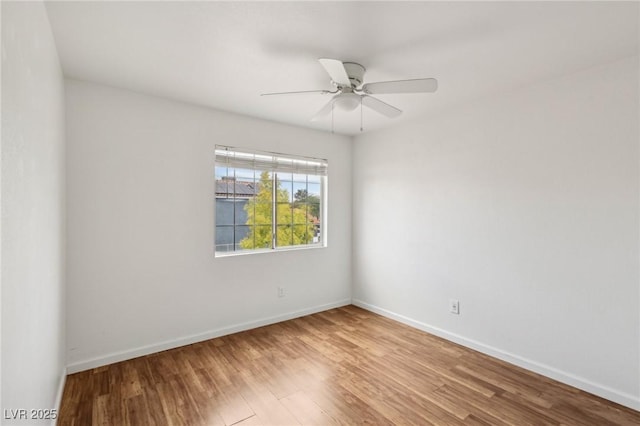 4552 Aviation St, Las Vegas, NV 89115 - spare room with wood finished floors, a ceiling fan, and baseboards
