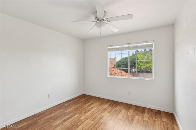 4552 Aviation St, Las Vegas, NV 89115 - empty room with baseboards, light wood-style floors, and ceiling fan