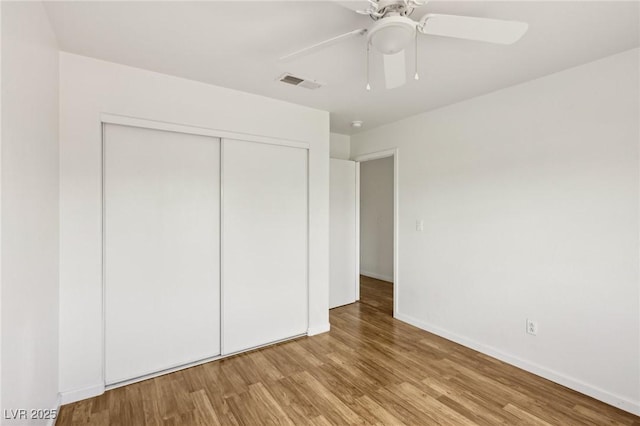 4552 Aviation St, Las Vegas, NV 89115 - unfurnished bedroom featuring wood finished floors, a closet, and baseboards