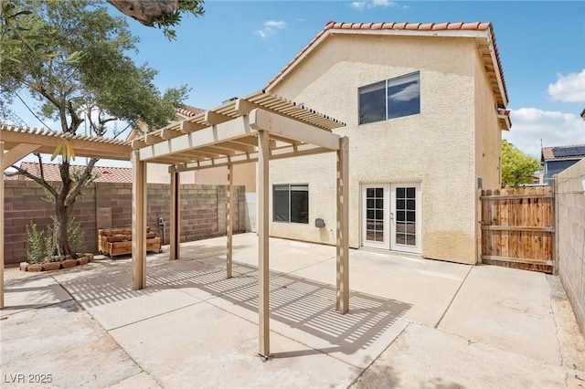 4552 Aviation St, Las Vegas, NV 89115 - rear view of property featuring stucco siding, a pergola, a patio, a fenced backyard, and french doors