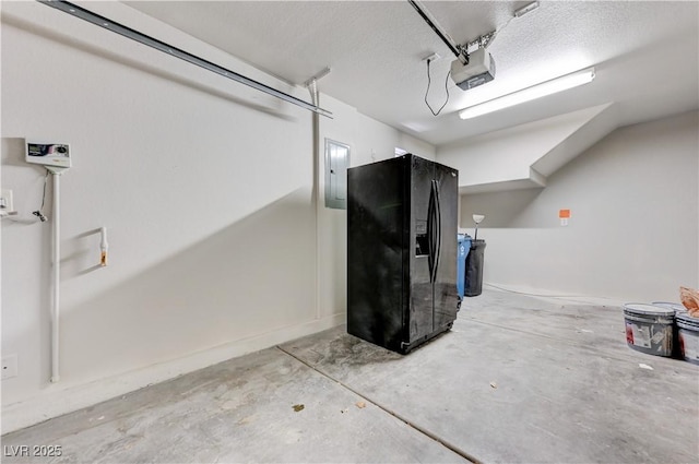 439 Royal Bridge Dr, Las Vegas, NV 89178 - garage with black fridge with ice dispenser, a garage door opener, and electric panel