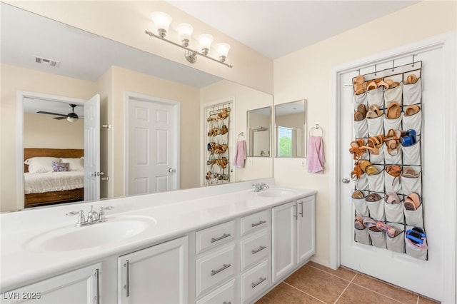 11226 Kenyan Sunshine Ct, Las Vegas, NV 89138 - bathroom featuring double vanity, tile patterned floors, ensuite bath, and a ceiling fan