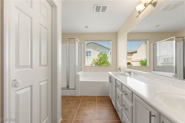 11226 Kenyan Sunshine Ct, Las Vegas, NV 89138 - full bath with a stall shower, a garden tub, tile patterned flooring, and double vanity