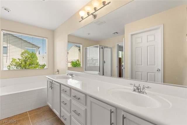 11226 Kenyan Sunshine Ct, Las Vegas, NV 89138 - full bath with double vanity, a stall shower, a garden tub, and tile patterned flooring