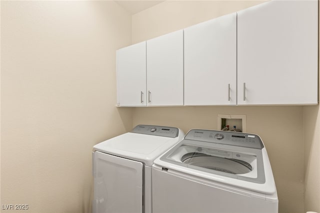 11226 Kenyan Sunshine Ct, Las Vegas, NV 89138 - laundry area featuring cabinet space and washing machine and dryer