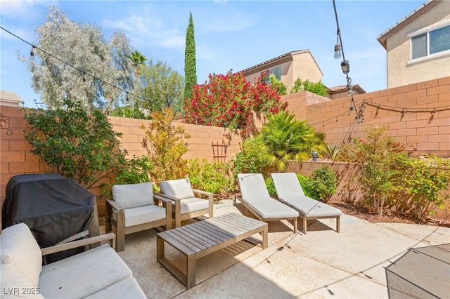11226 Kenyan Sunshine Ct, Las Vegas, NV 89138 - fenced backyard featuring a patio area, outdoor lounge area, and a grill