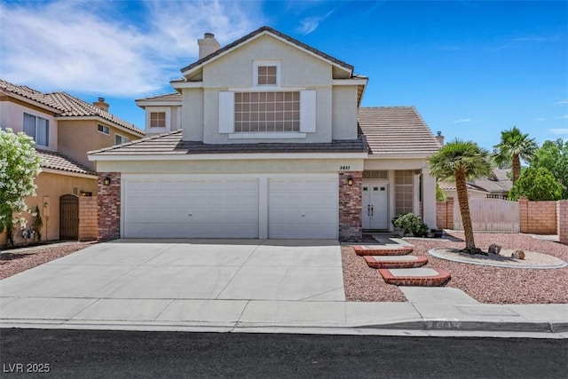8481 Lambert Dr, Las Vegas, NV 89147 - traditional-style home featuring an attached garage, driveway, brick siding, a chimney, and a tiled roof