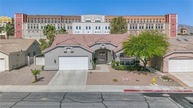 401 Obsidian St, Las Vegas, NV 89145 - view of front of home featuring driveway, stucco siding, a garage, and a tile roof
