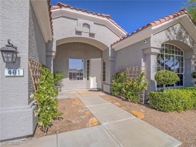401 Obsidian St, Las Vegas, NV 89145 - entrance to property with a tile roof and stucco siding