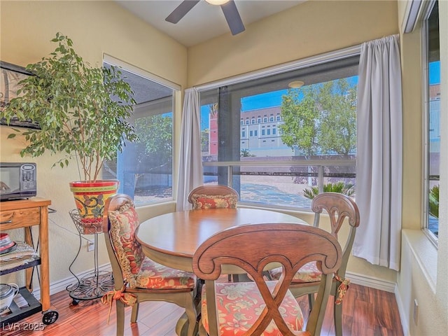 401 Obsidian St, Las Vegas, NV 89145 - dining room featuring wood finished floors, a ceiling fan, and baseboards
