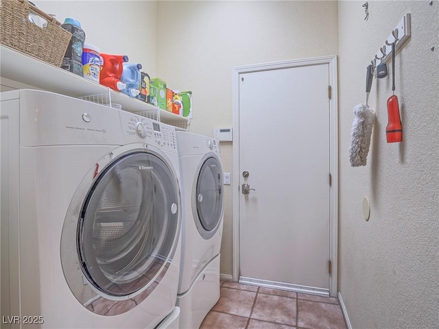 401 Obsidian St, Las Vegas, NV 89145 - washroom featuring washer and dryer, baseboards, and light tile patterned floors