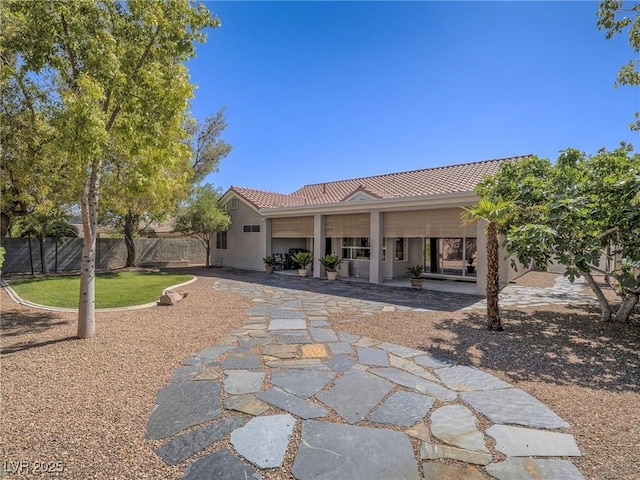 401 Obsidian St, Las Vegas, NV 89145 - rear view of house with a tile roof, stucco siding, and a patio area