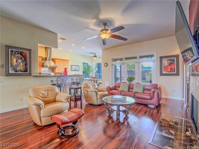 401 Obsidian St, Las Vegas, NV 89145 - living room with baseboards, wood finished floors, a ceiling fan, a textured ceiling, and recessed lighting