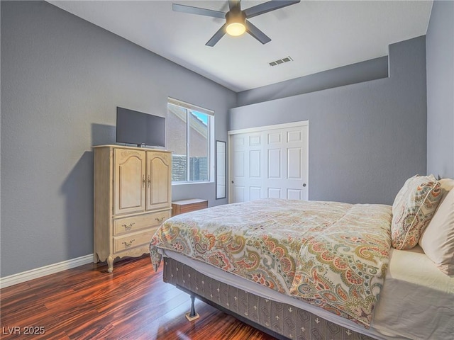 401 Obsidian St, Las Vegas, NV 89145 - bedroom featuring dark wood-style flooring, baseboards, a closet, and a ceiling fan