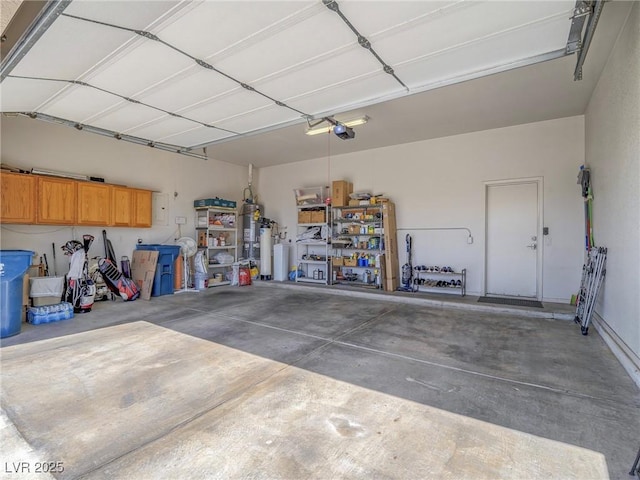 401 Obsidian St, Las Vegas, NV 89145 - garage with a garage door opener and strapped water heater