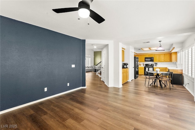 8612 Danza Del Sol Dr, Las Vegas, NV 89128 - living room with plenty of natural light, wood finished floors, and stairway