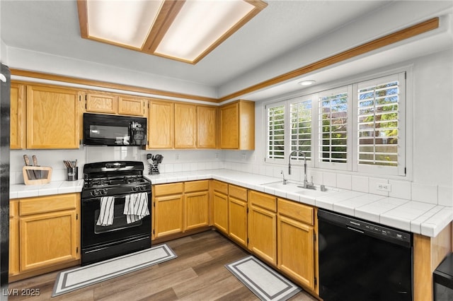 8612 Danza Del Sol Dr, Las Vegas, NV 89128 - kitchen with black appliances and dark wood-type flooring