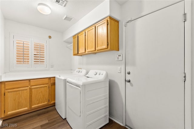 8612 Danza Del Sol Dr, Las Vegas, NV 89128 - washroom featuring washing machine and dryer, cabinet space, and dark wood-type flooring
