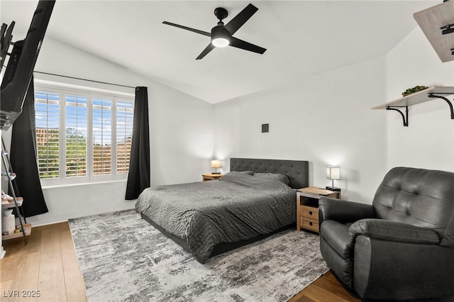 8612 Danza Del Sol Dr, Las Vegas, NV 89128 - bedroom featuring vaulted ceiling, hardwood / wood-style flooring, and ceiling fan
