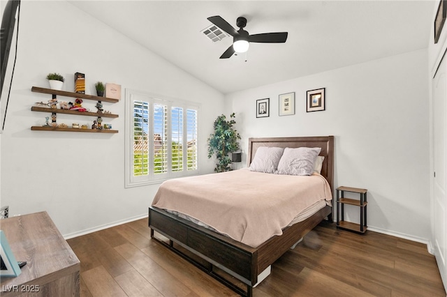 8612 Danza Del Sol Dr, Las Vegas, NV 89128 - bedroom with dark wood-style floors, lofted ceiling, baseboards, and ceiling fan