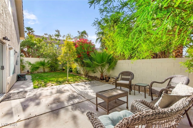 8612 Danza Del Sol Dr, Las Vegas, NV 89128 - fenced backyard with a patio and an outdoor living space