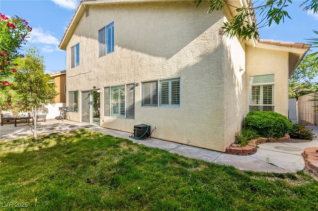 8612 Danza Del Sol Dr, Las Vegas, NV 89128 - rear view of house featuring stucco siding and a patio