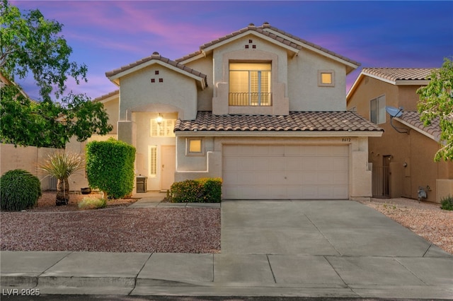 8612 Danza Del Sol Dr, Las Vegas, NV 89128 - mediterranean / spanish-style home featuring a tile roof, stucco siding, driveway, and a garage