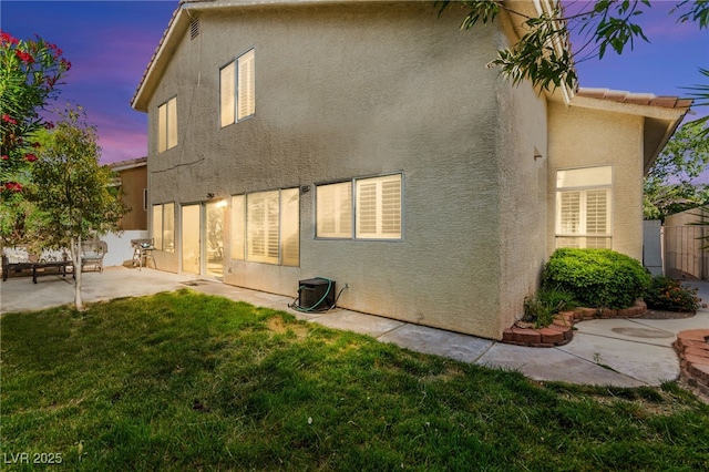 8612 Danza Del Sol Dr, Las Vegas, NV 89128 - rear view of property with stucco siding and a patio