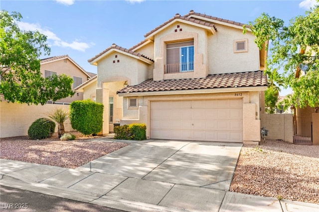 8612 Danza Del Sol Dr, Las Vegas, NV 89128 - mediterranean / spanish home featuring a tiled roof, concrete driveway, a garage, and stucco siding