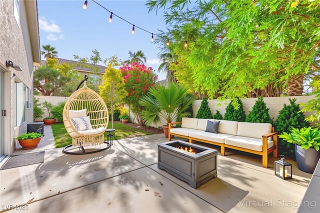 8612 Danza Del Sol Dr, Las Vegas, NV 89128 - fenced backyard featuring an outdoor living space with a fire pit and a patio area